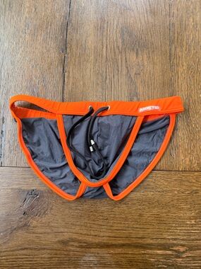 Addicted Brands Men's Swim Brief in Orange and Charcoal Gray